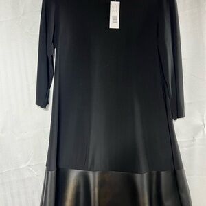 This is your basic little black dress w/a pleather strip around the bottom.